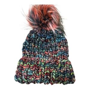 Hand knit variegated knit hat with faux fur pom
